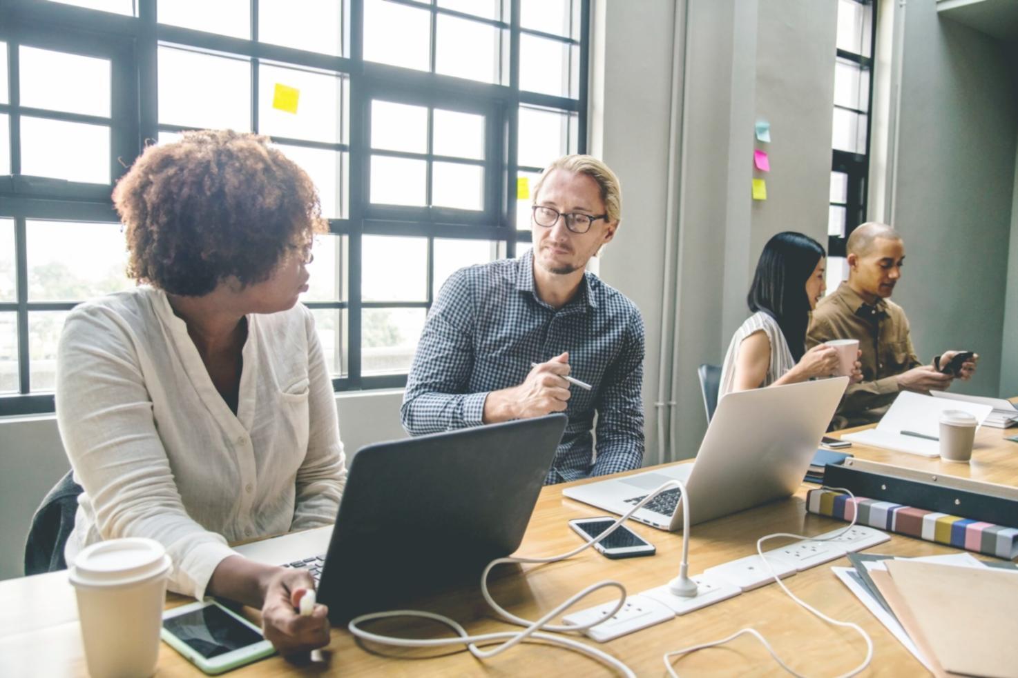 Financial planning materials spread on desk with calculator and notes