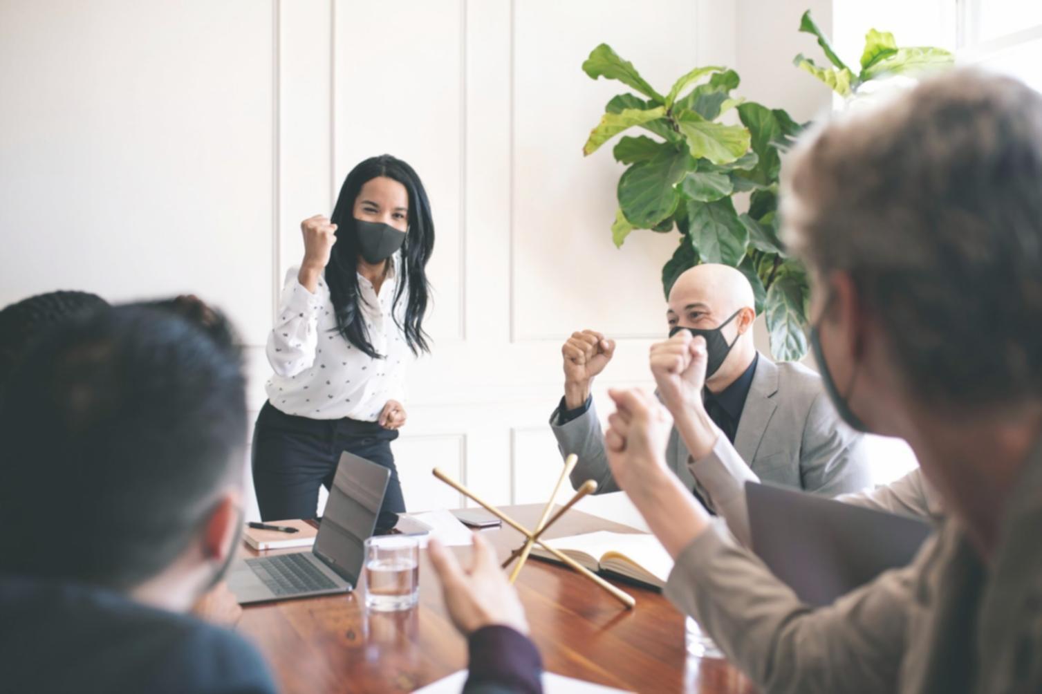 Family reviewing financial documents together at kitchen table